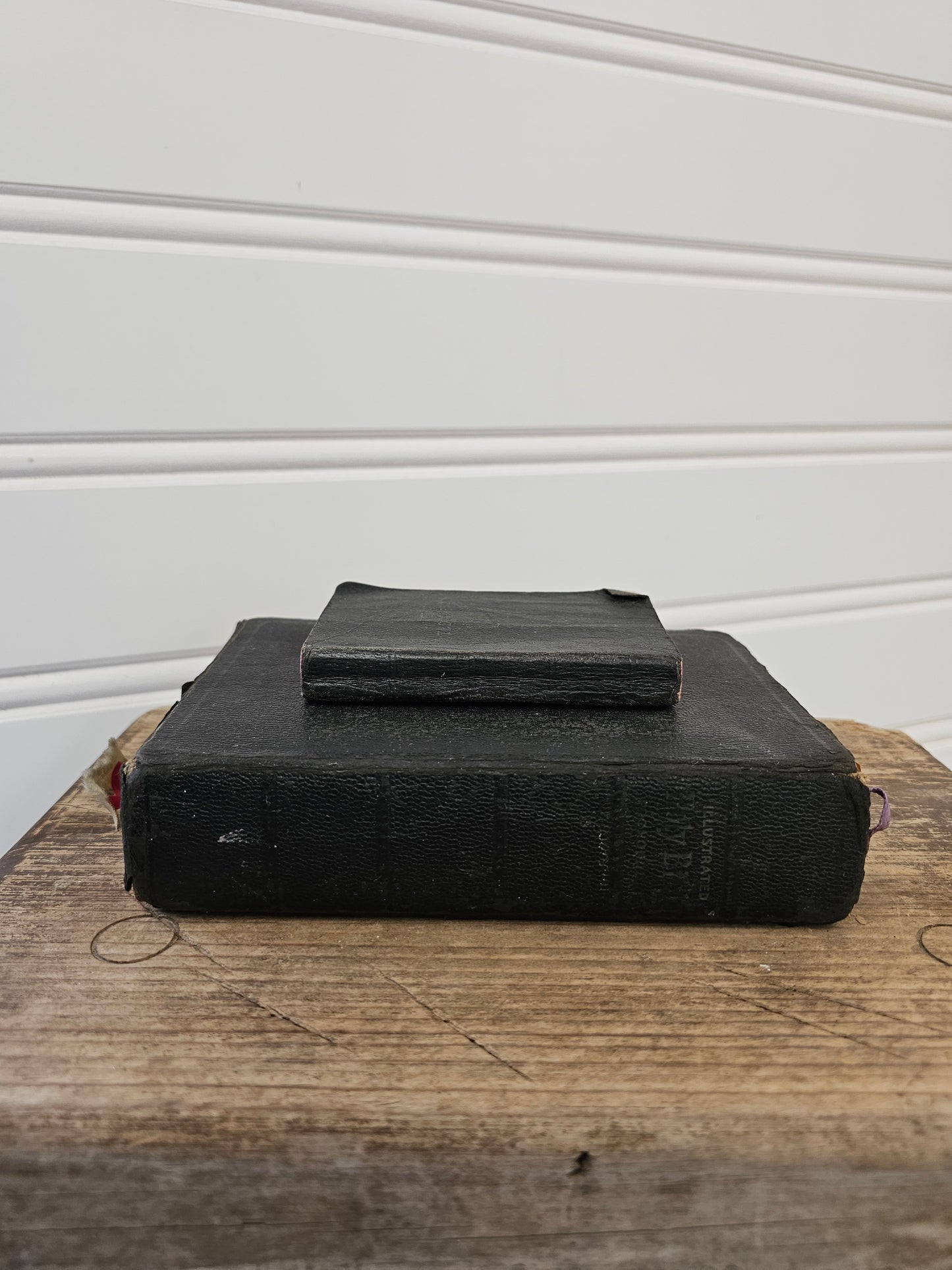 set of 2 vintage bibles - black leather with red pages