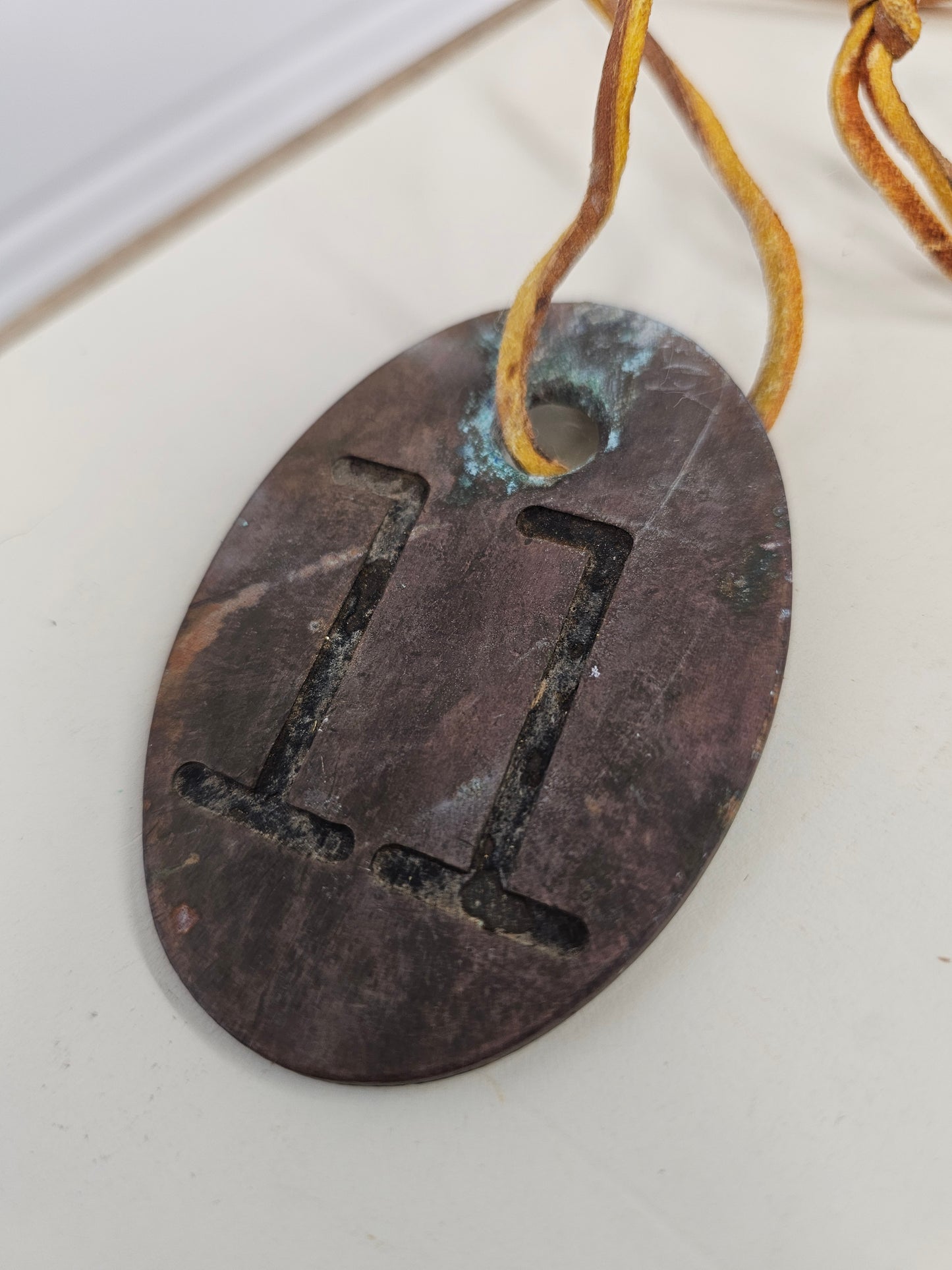 vintage copper #11 tag