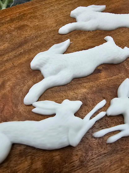 set of 4 resin rabbits