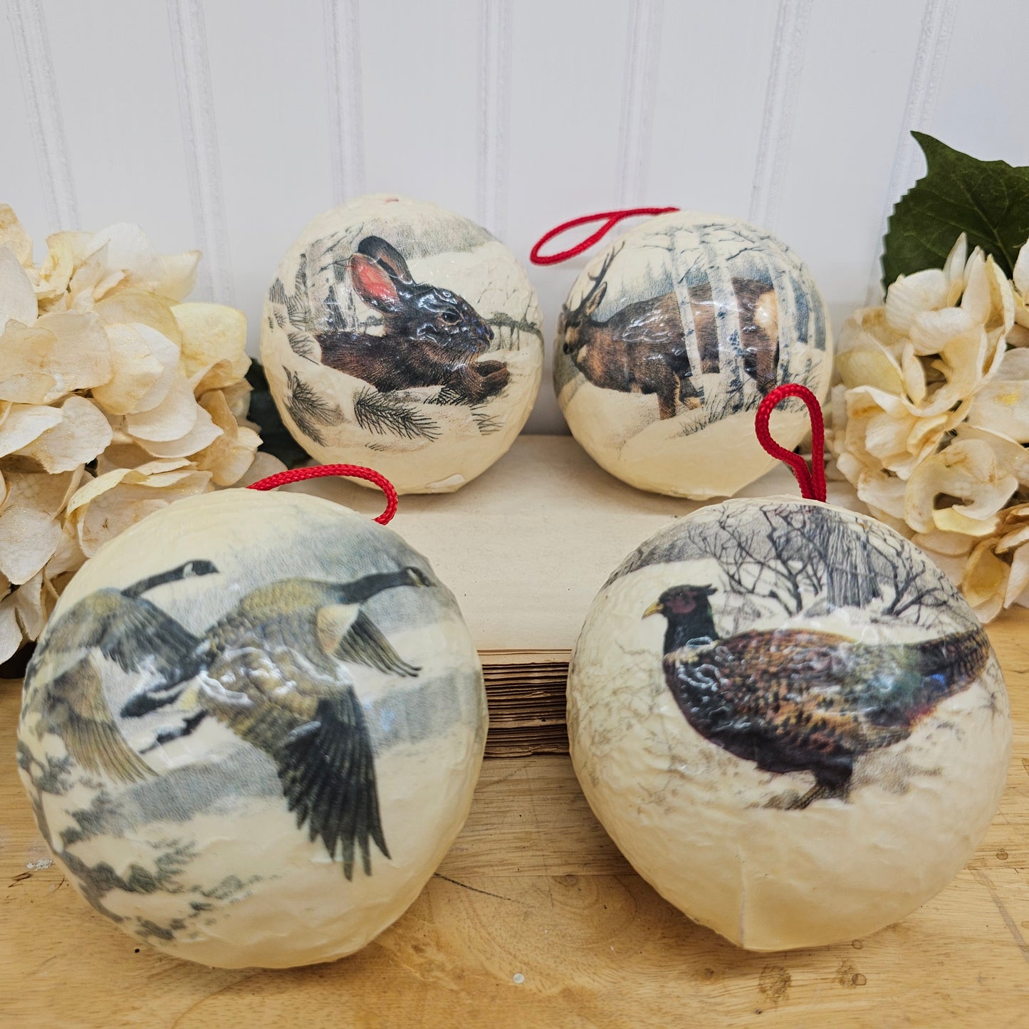 Set of 4 paper mache wild lift ornaments