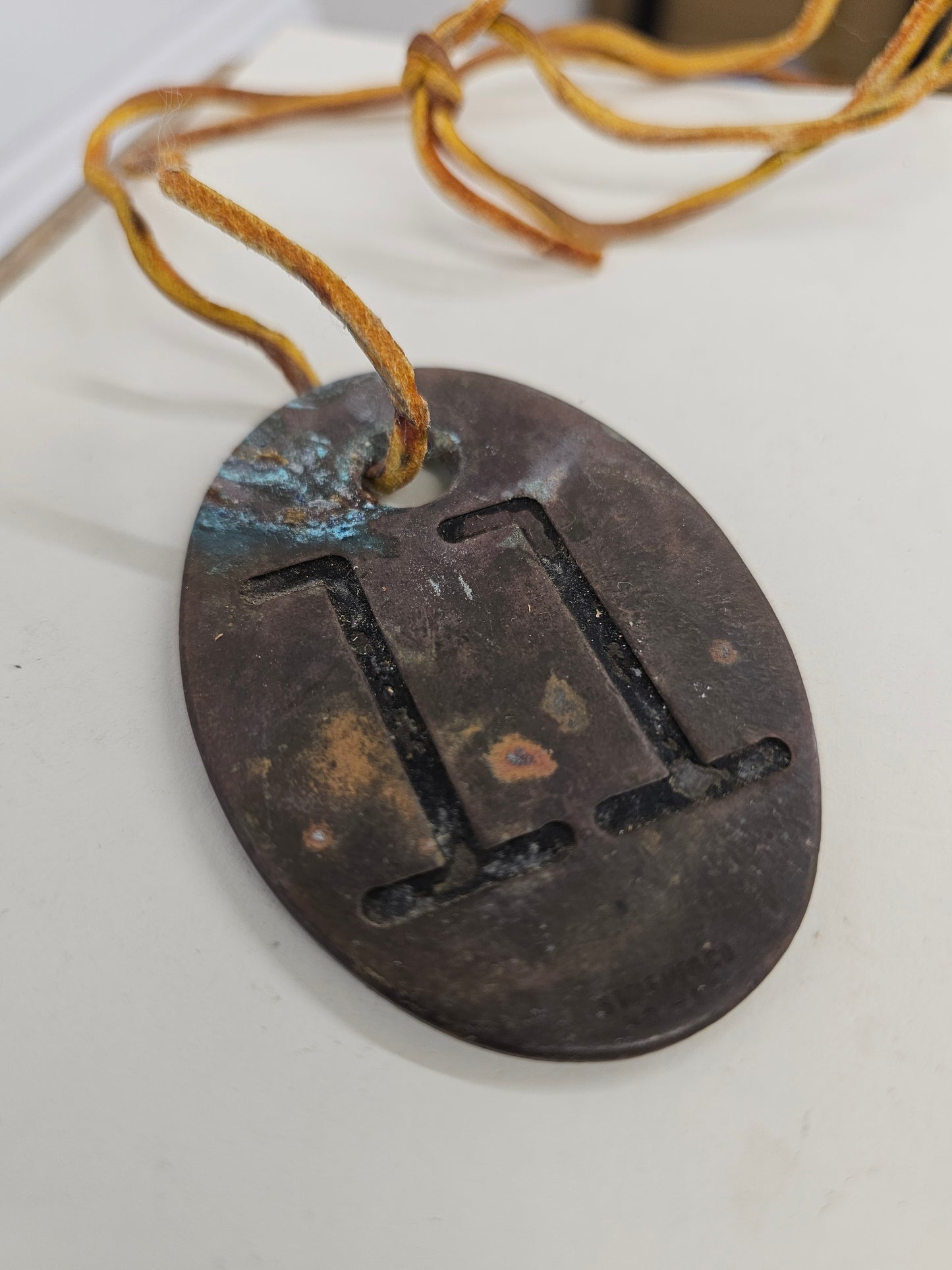 vintage copper #11 tag