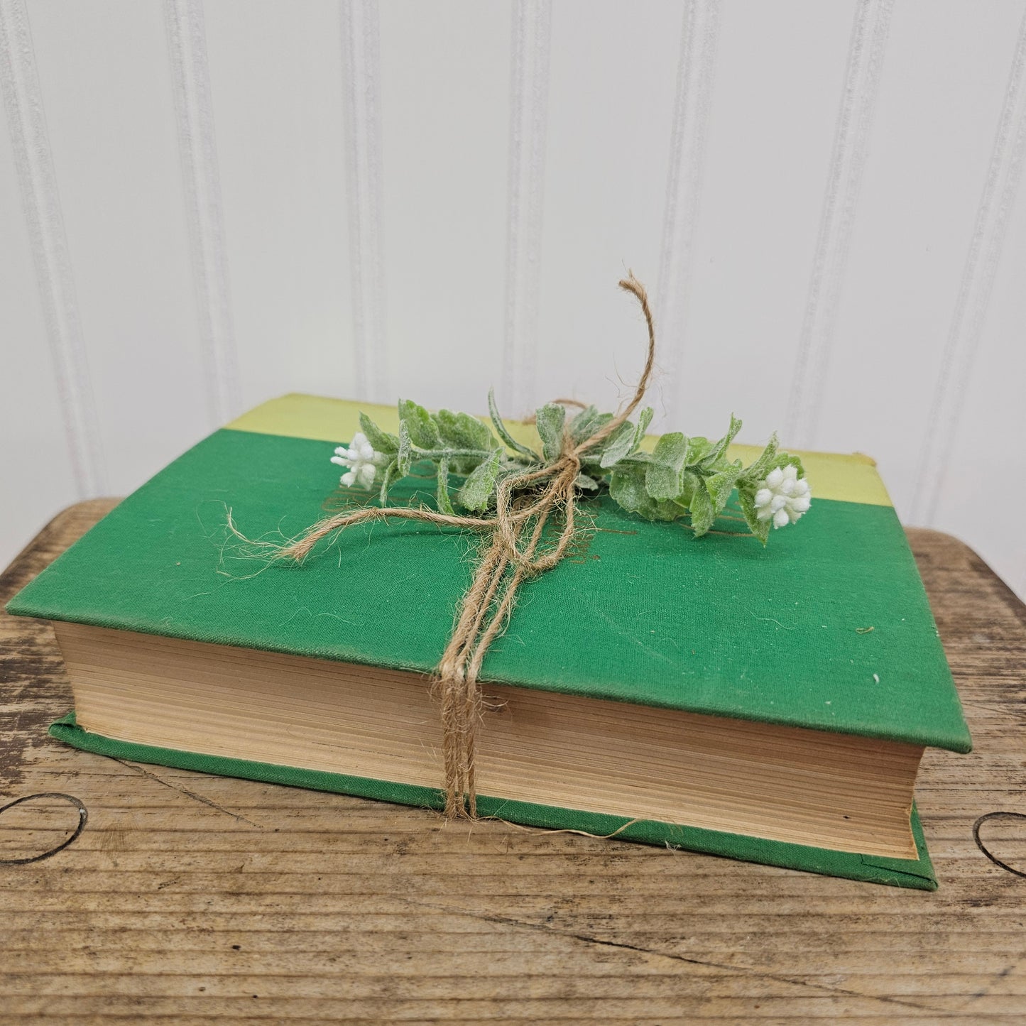 Green readers digest book with twine