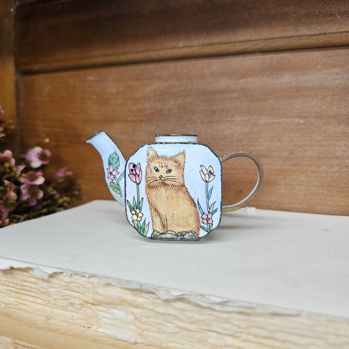 Miniature hand painted metal teapot