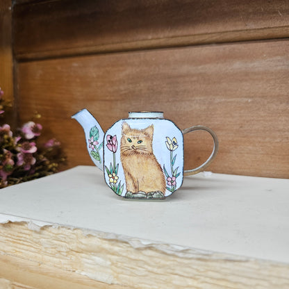 Miniature hand painted metal teapot