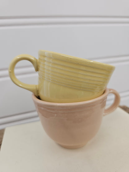 set of 2 yellow and pink vintage cups