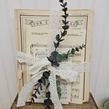 3 lbs Music sheet bundle tied together with lace and greenery