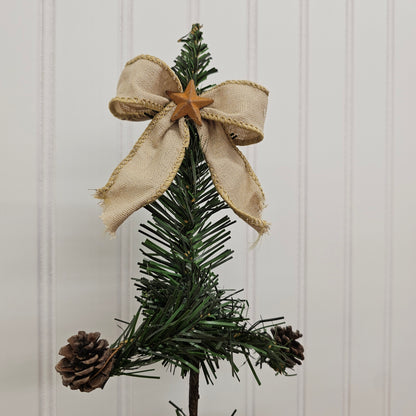 handmade vintage style Christmas tree with pinecones and bow