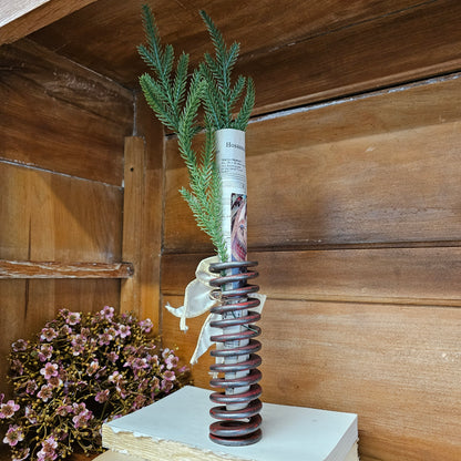 chippy red metal spring with Christmas embellishments