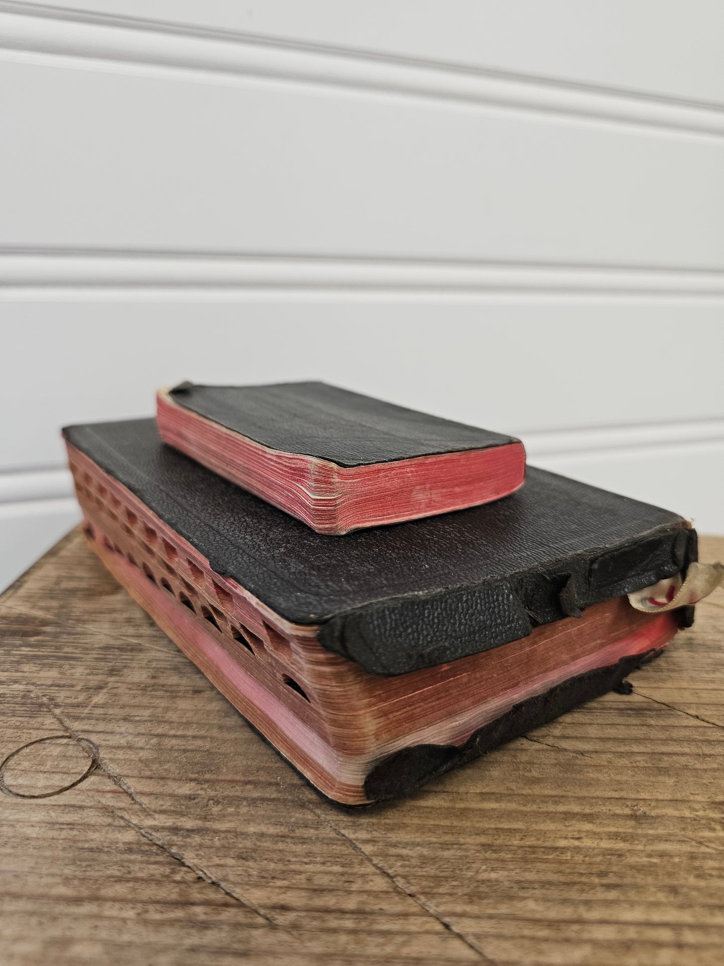 set of 2 vintage bibles - black leather with red pages