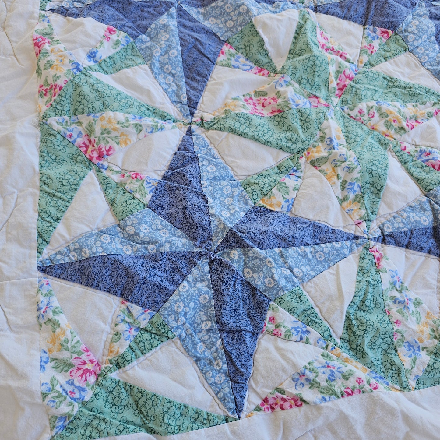 Blue floral quilt, approx 79" x 71", as is