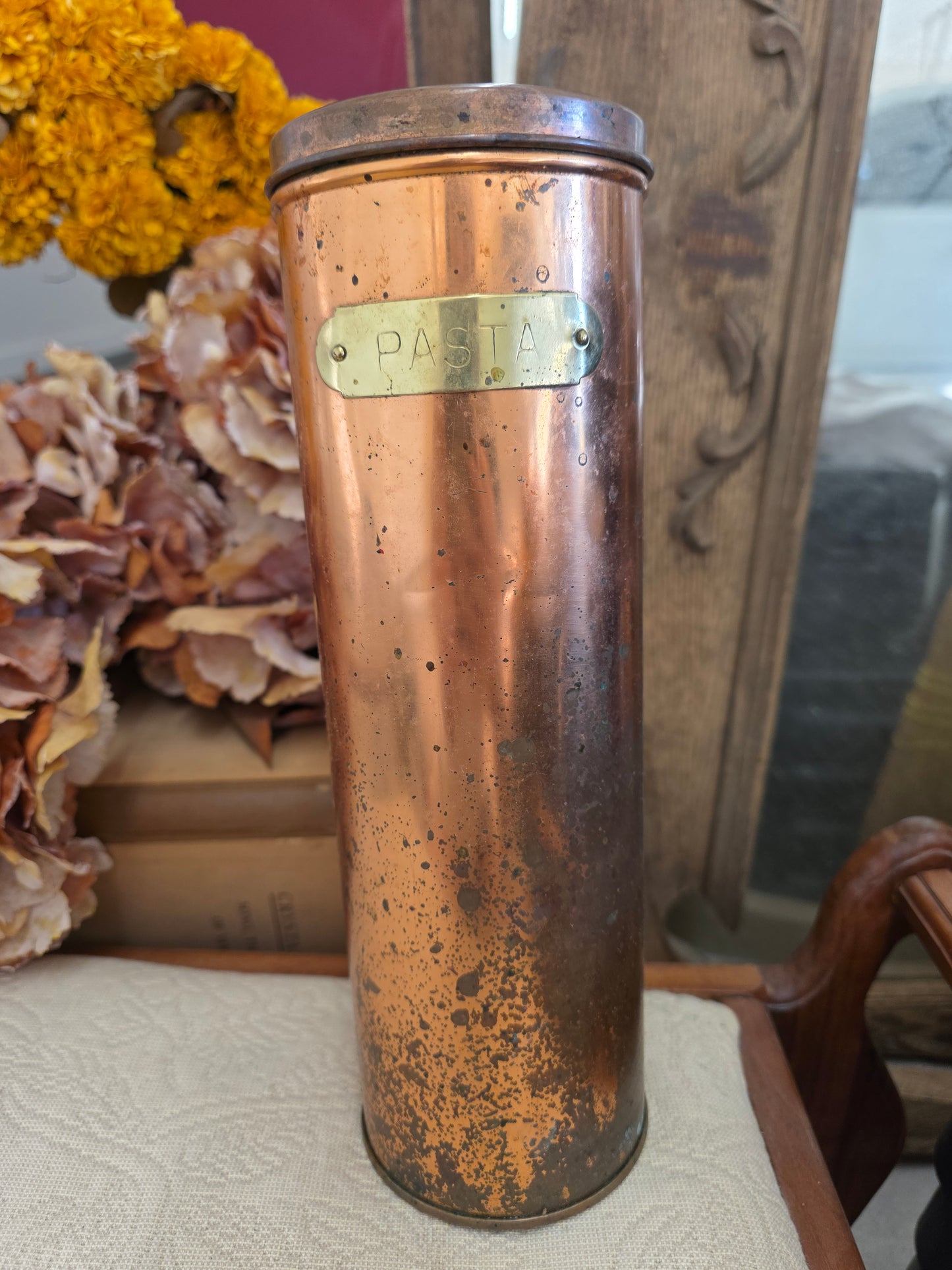 vintage copper colored pasta container