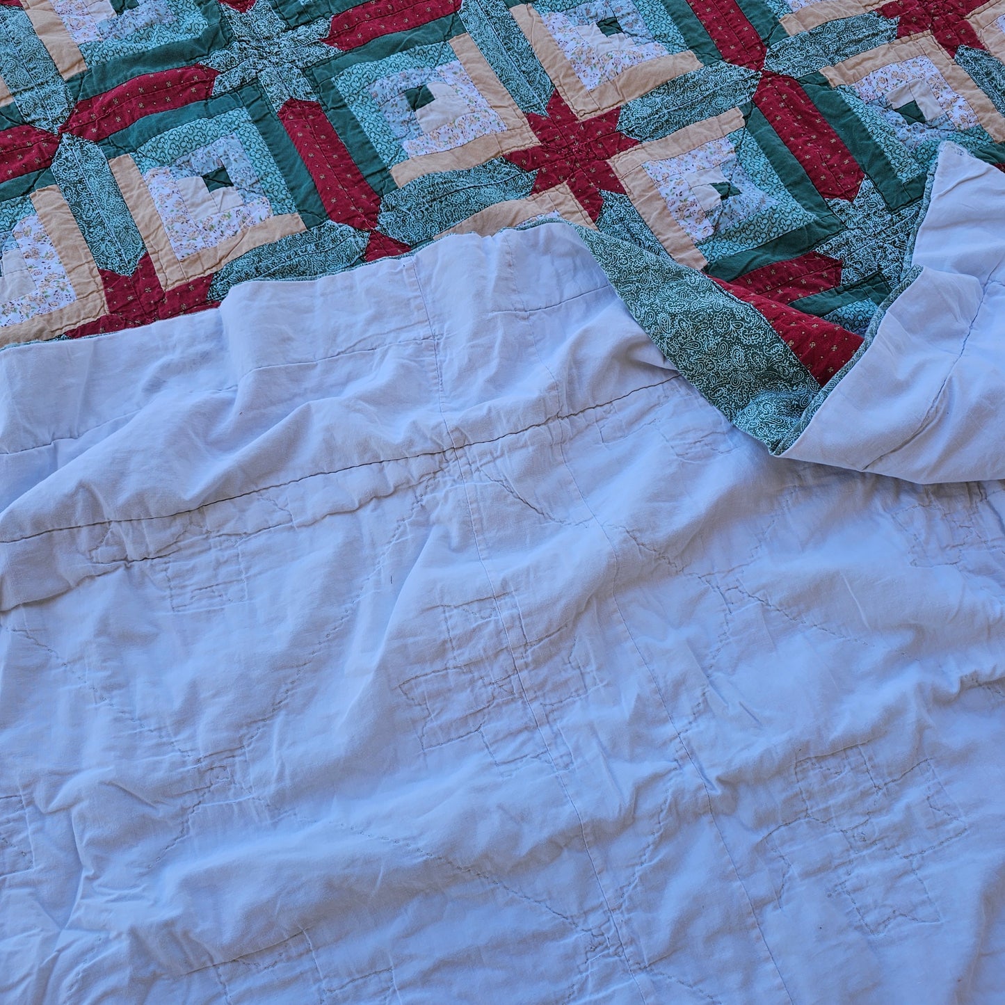 Christmas colored quilt approx 88" x 76", as is