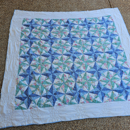 Blue floral quilt, approx 79" x 71", as is