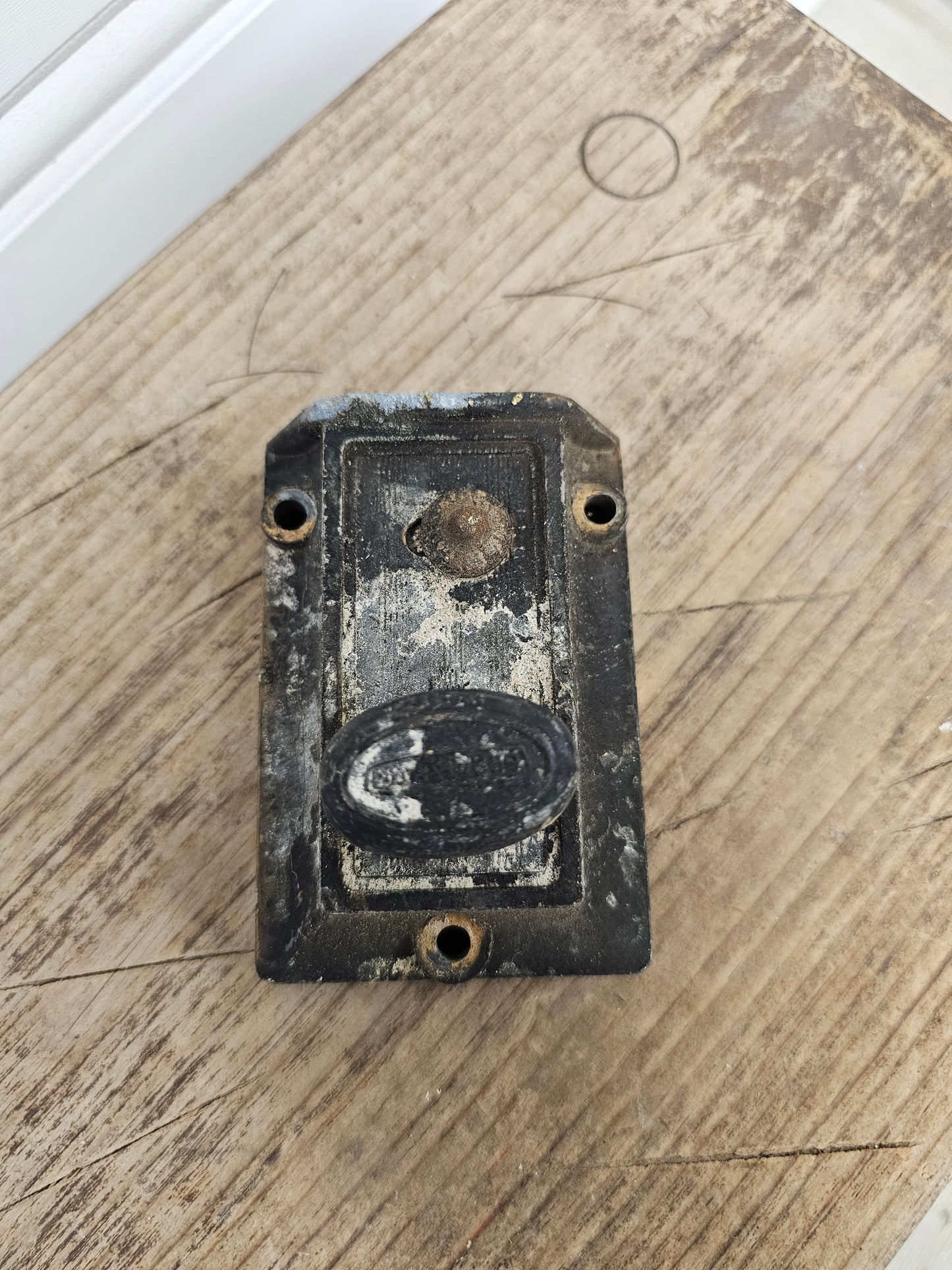 Vintage-style door lock on a wooden surface